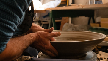 Inside the studio, terracotta jars aligned for drying, Atelier De Maindis